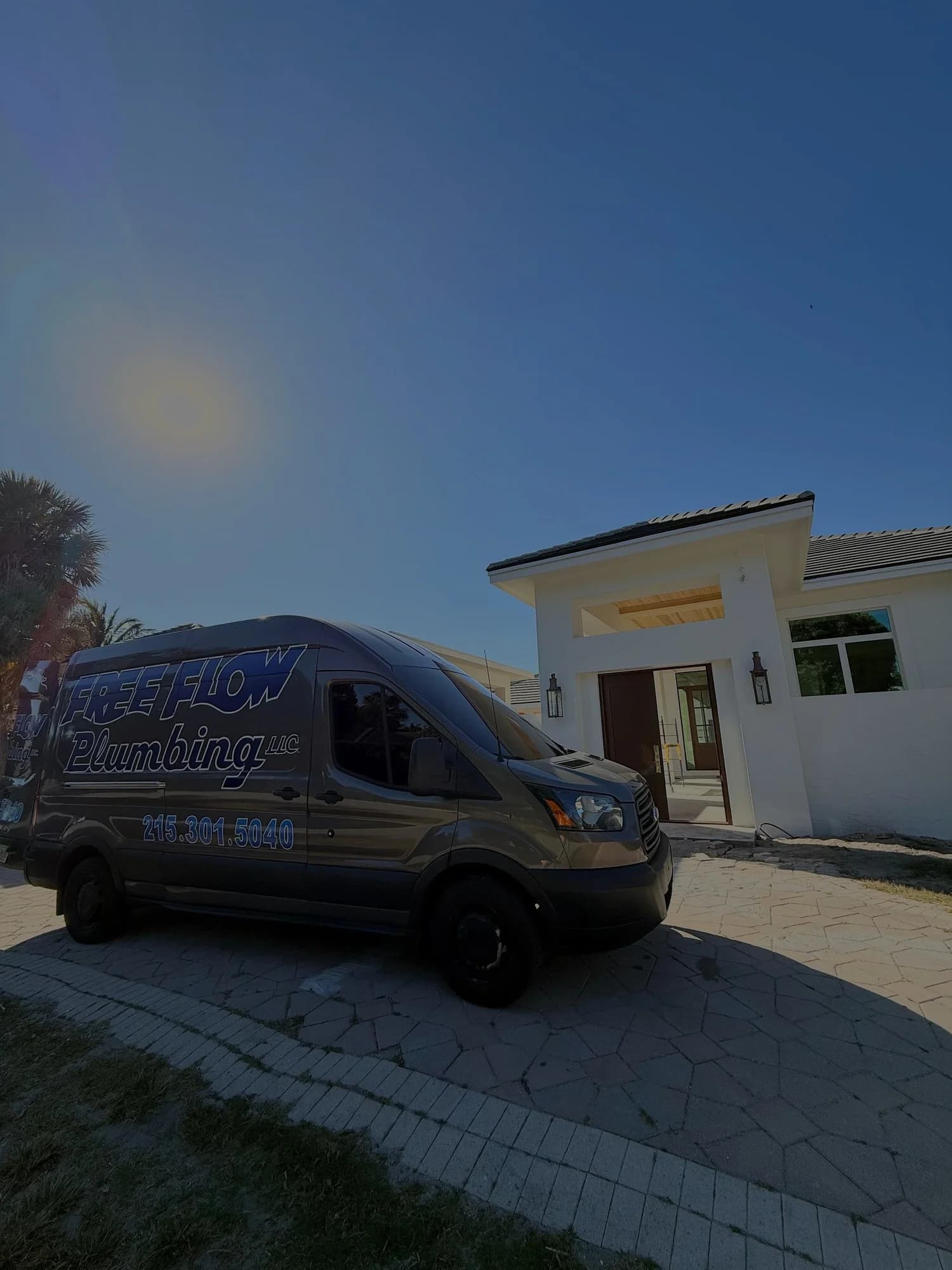 Free Flow company van outside a South Florida home